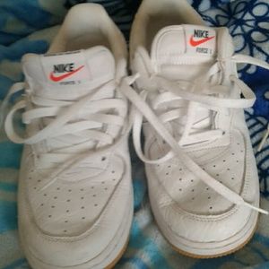 Kids white Nike shoes